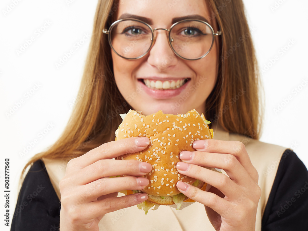 girl eating a burger on a white background girl eating a burger on a white background