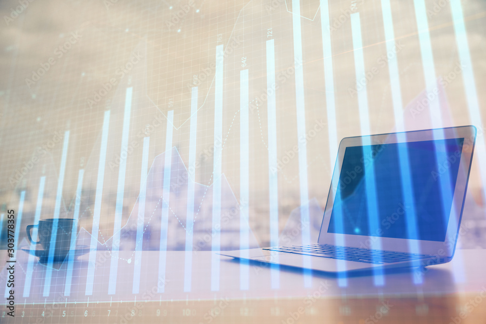 Forex graph hologram on table with computer background. Multi exposure. Concept of financial markets. Forex graph hologram on table with computer background. Multi exposure. Concept of financial markets.