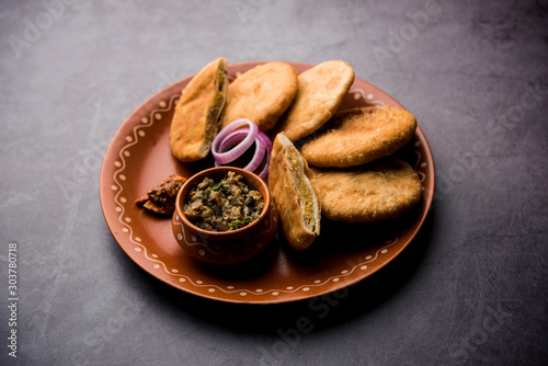 Fried Sattu Litti chokha served with Baingan Bharta, onion and pickle, popular recipe from Bihar, India photo