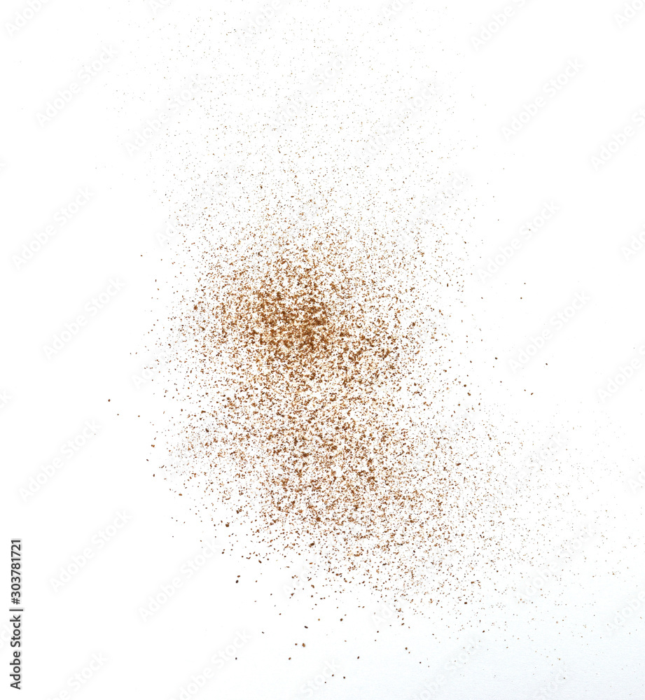 Spice cinnamon powder isolated on a white background. Cinnamon powder spilled on a white surface.