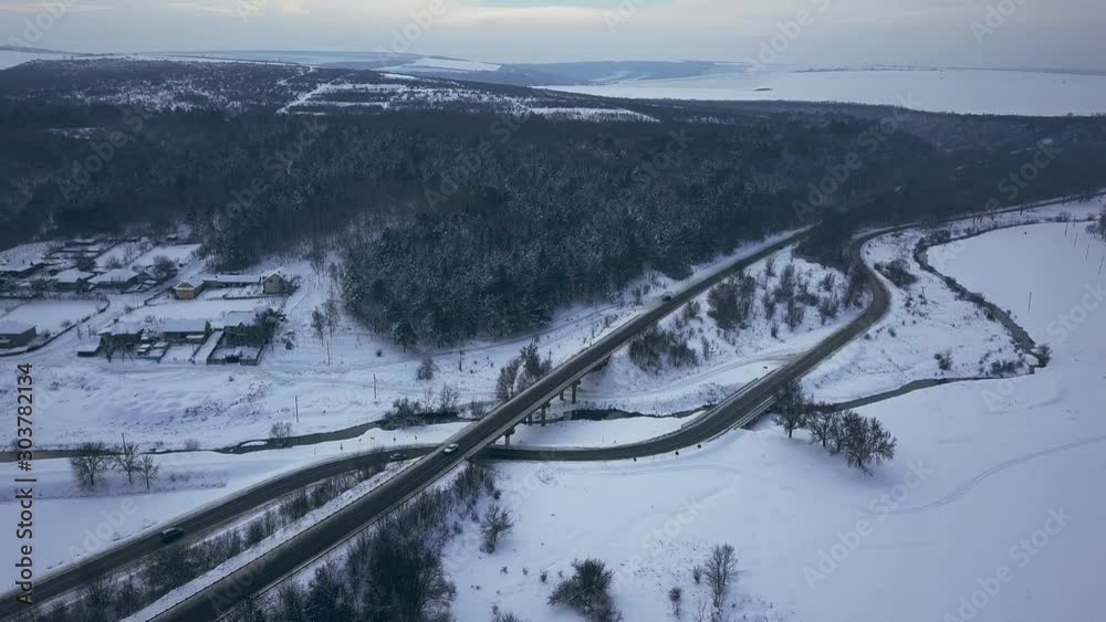 Aerial or top view from a drone on a highway in winter weather Aerial or top view from a drone on a highway in winter weather