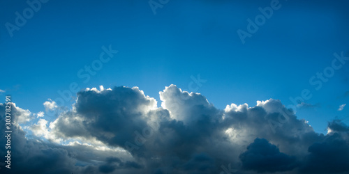 Atmospheric sky art image. A sky cloudscape scene, with well developed white and grey Cumulonimbus cloud in a mid blue sky. Australia. © geoff childs. 