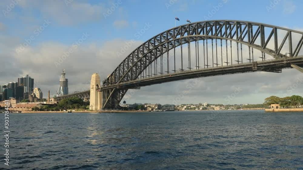Architectural landmarks of Sydney city on shores of Sydney harbour in bright day sun light – from the Harbour Bridge to Circular quay waterfront. Architectural landmarks of Sydney city on shores of Sydney harbour in bright day sun light – from the Harbour Bridge to Circular quay waterfront.