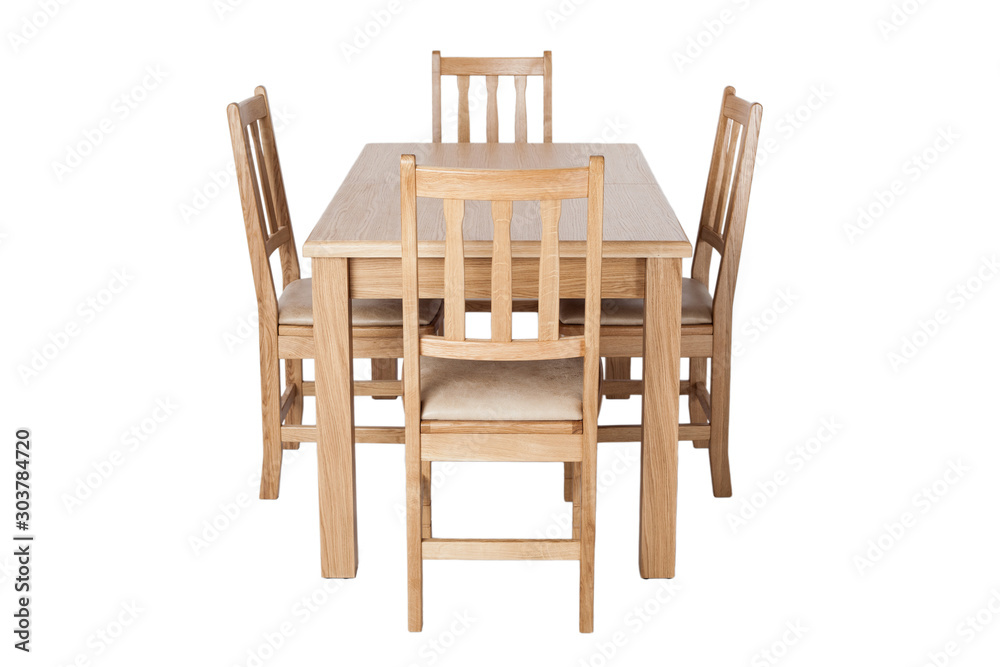 A set of kitchen furniture made of natural wood, a dining table and four chairs, isolated on the white background. A set of kitchen furniture made of natural wood, a dining table and four chairs, isolated on the white background.