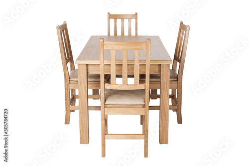 A set of kitchen furniture made of natural wood, a dining table and four chairs, isolated on the white background.