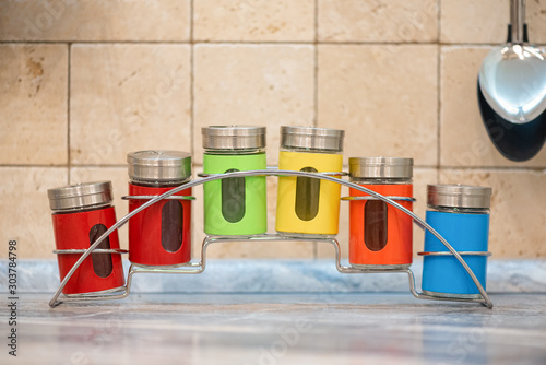 Wallpaper Mural Colorful spice jars on kitchen table background. Torontodigital.ca