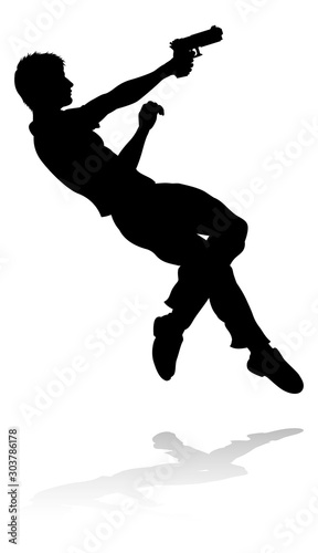 Silhouette person in an action movie film shoot out pose
