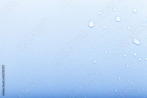 Drops of water on a color background. Selective focus. Blue. Toned