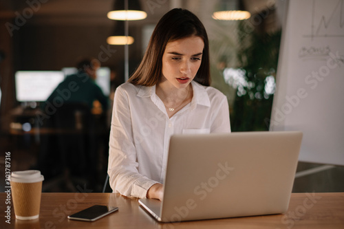 Portrait of tired businesswoman. Young businesswoman working late night