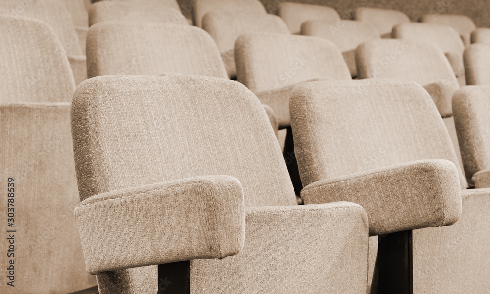 Empty rows of theater or movie seats.