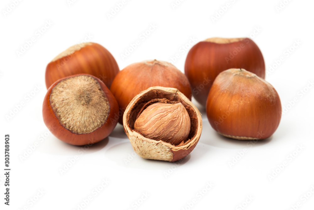 Hazelnut nut many leaves isolated on a white background as a packaging design element Hazelnut nut many leaves isolated on a white background as a packaging design element