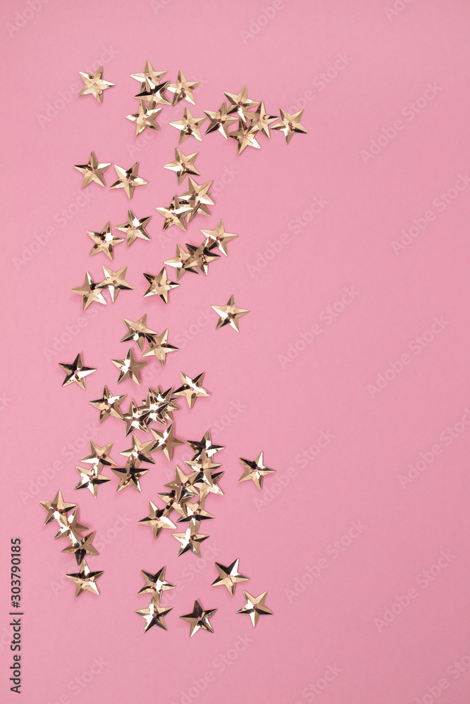 small blur golden stars on pink background