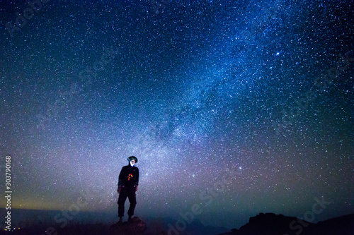 Landscape with Milky way, Milky way background, Night sky with stars and galaxy over night sky and silhouette of a standing people in Thailand