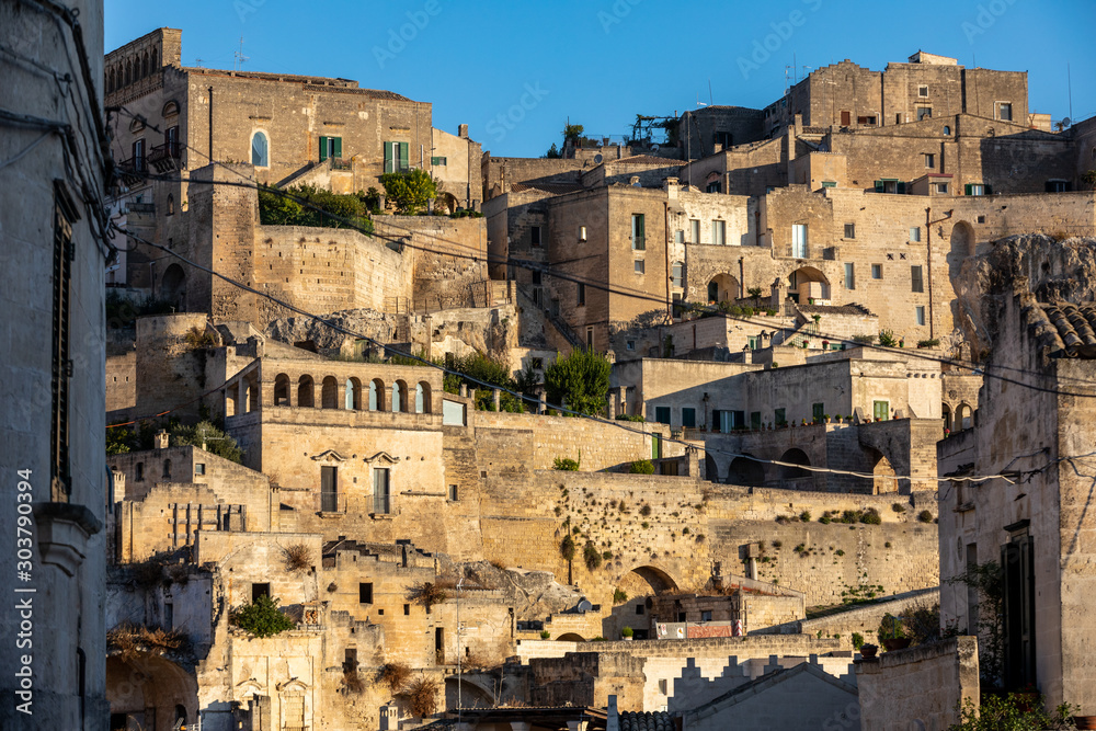 View of the Sassi di Matera a historic district in the city of Matera, well-known for their ancient cave dwellings. Basilicata. Italy View of the Sassi di Matera a historic district in the city of Matera, well-known for their ancient cave dwellings. Basilicata. Italy