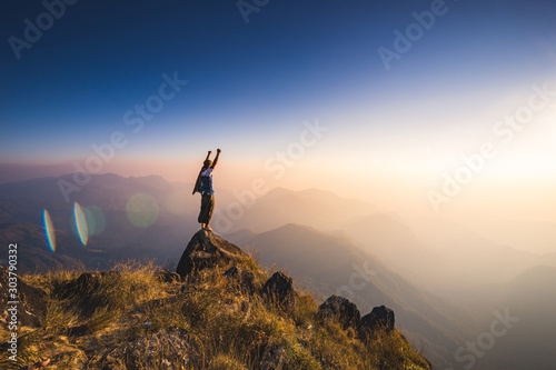 Mulayit Taung, Myanmar – mar 03 2019  Beautiful landscape panorama of young  Asia tourist at mountain is watching over the misty and foggy in morning sunrise, travel Trekking