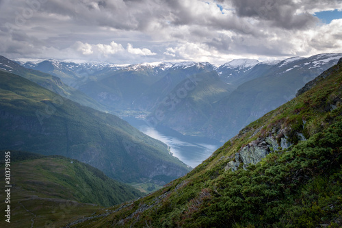 Breathtaking dark fjord landscape from Prest vista onto Aurland town Norway