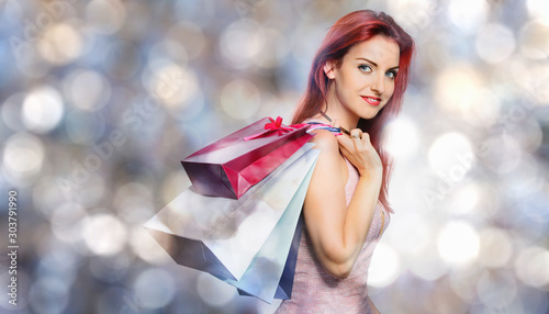 Redhead women with shopping bags