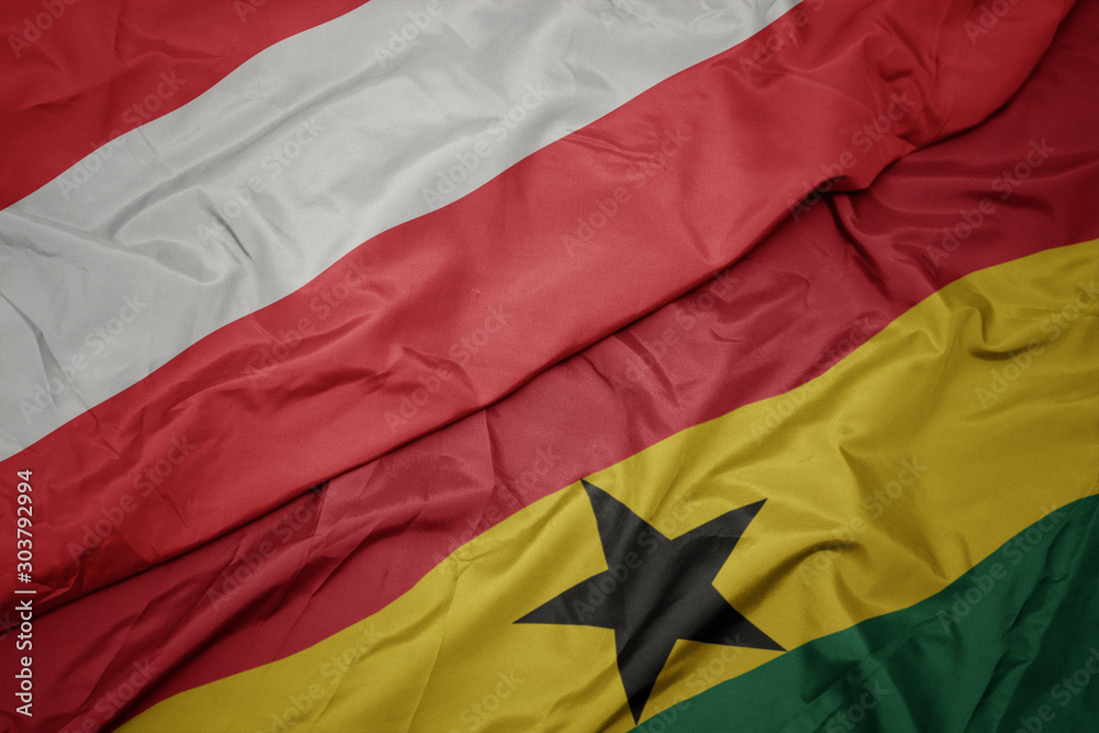 waving colorful flag of ghana and national flag of austria. waving colorful flag of ghana and national flag of austria.