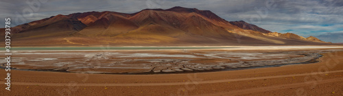 Vast salt lake with mountains in Atacama photo