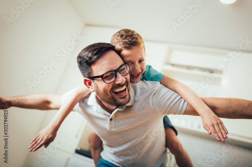 Father and son having fun at home.