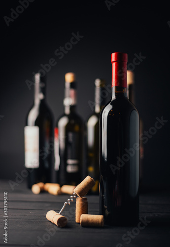 bottle and glass of red wine photo