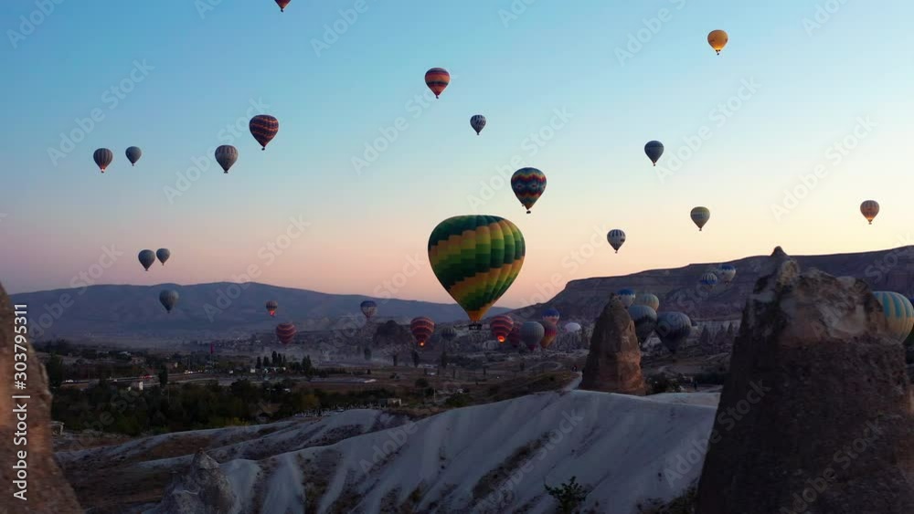 Early morning silhouetted hot air balloons against the skies of Goreme Cappadocia, Turkey