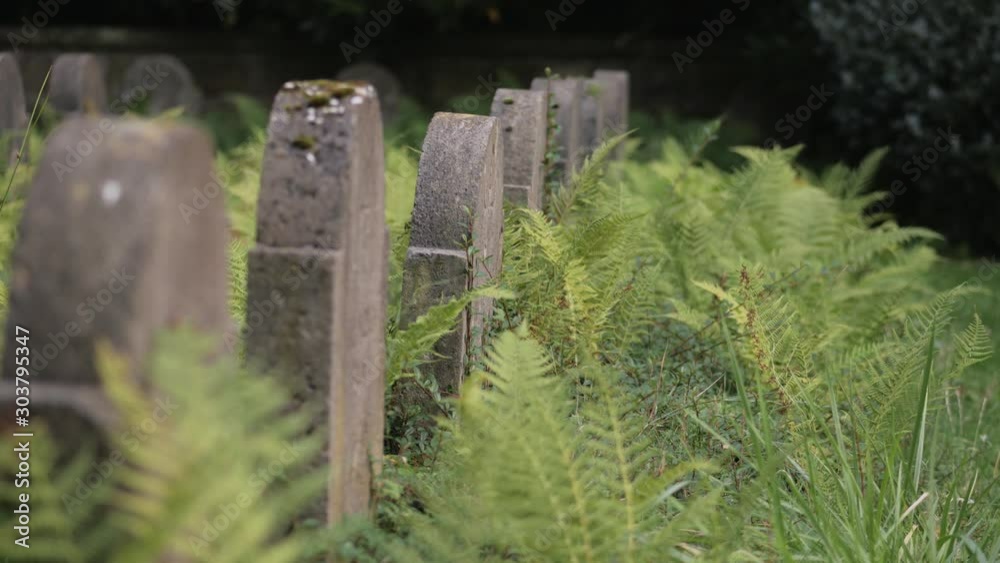Row of gravestones of fallen soldiers from world war one in between froground. Focus rack from side view. Row of gravestones of fallen soldiers from world war one in between froground. Focus rack from side view.