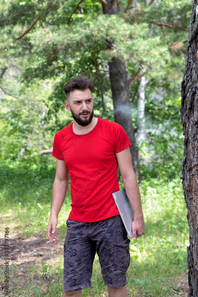 Workaholic, work on vacation. Young man with laptop working in park. Freedom, remote work, freelancer, travel and vacation concepts. Workaholic, work on vacation. Young man with laptop working in park. Freedom, remote work, freelancer, travel and vacation concepts.