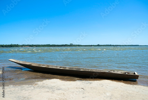 Wooden boat parked by the river