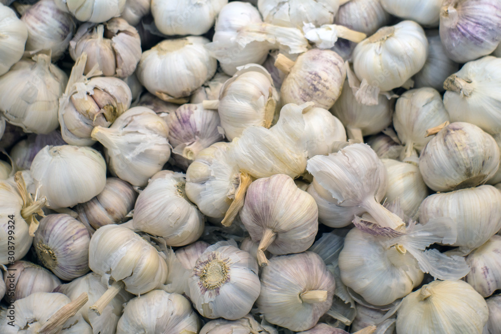 Dried garlic background, texture, vegetable sale, selective focus Dried garlic background, texture, vegetable sale, selective focus