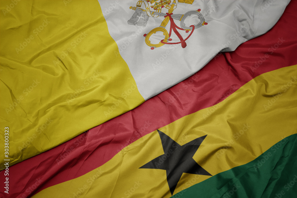 waving colorful flag of ghana and national flag of vatican city. waving colorful flag of ghana and national flag of vatican city.