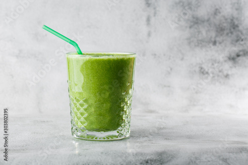 Fresh green smoothie from fruit and vegetables for a healthy lifestyle spinach, green Apple, cucumber, isolated on bright marble background. Overhead view, copy space. cafe menu. Horizontal photo.