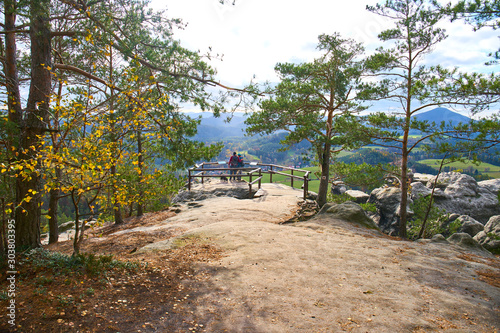 Hikers looking towards Mariina Vyhlidka at Bohemian Switzerland Natural Park                                                            