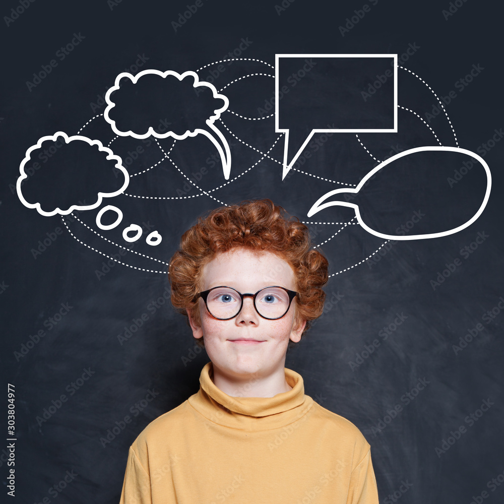 Kid student and empty speech clouds bubbles on blackboard background
