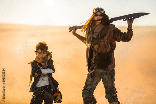 Post apocalyptic Woman and Boy Outdoors in a Wasteland