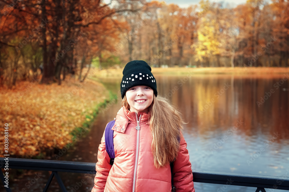 Girl is walking in the autumn Park