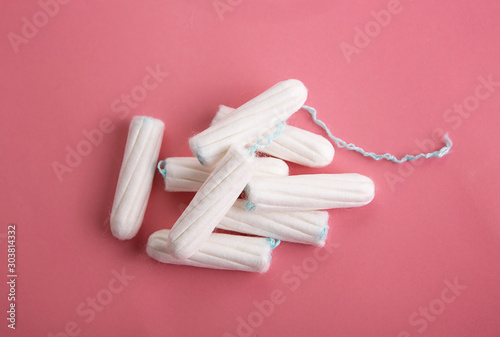 Medical female tampon on a pink background. photo