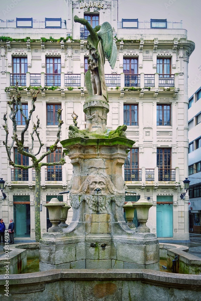  Ancient fountain in the town square. Corunna is famous touristic city and municipality of Galicia, Spain.