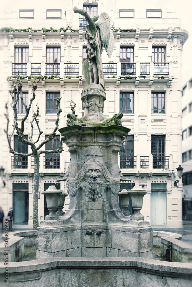  Ancient fountain in the town square. Corunna is famous touristic city and municipality of Galicia, Spain.