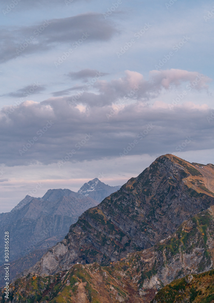 Mountains at sunset. Mountain landscape. Clouds in Sochi. Rosa Khutor