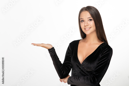 business smiling woman pointing at copy space hand hold