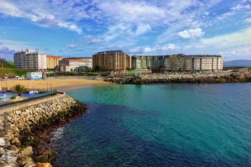 Coastline with cloudy sky in the sunny day in Corunna, Spain photo