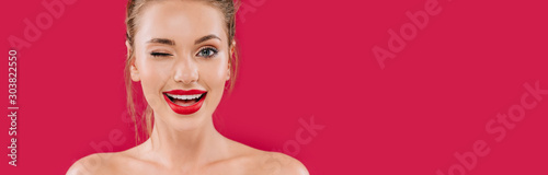 Fotografija smiling naked beautiful woman with red lips winking isolated on red, panoramic s