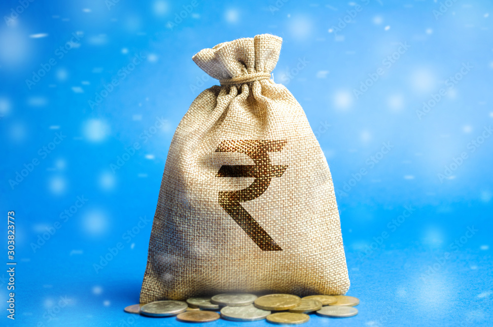 Money bag with coins and snowfall. Holiday loans deposit credit. Business and finance. New Year promotions and Christmas. Accumulation of money. Savings. Winter season Stock Foto Adobe Stock