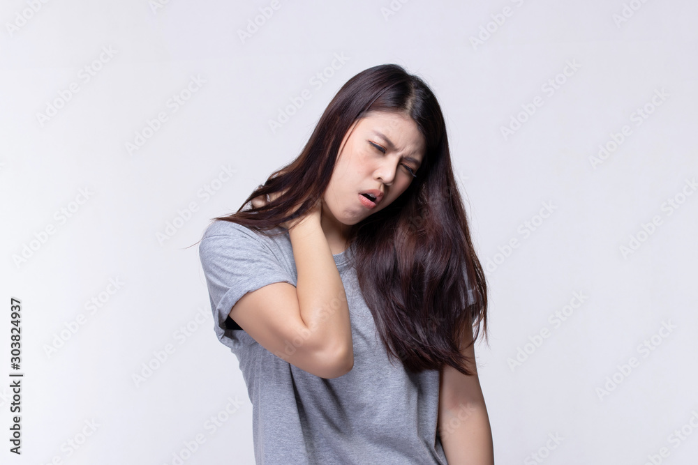Beautiful young woman feeling face that expression pain holding neck and shoulder. Health care and medical concept. Beautiful young woman feeling face that expression pain holding neck and shoulder. Health care and medical concept.