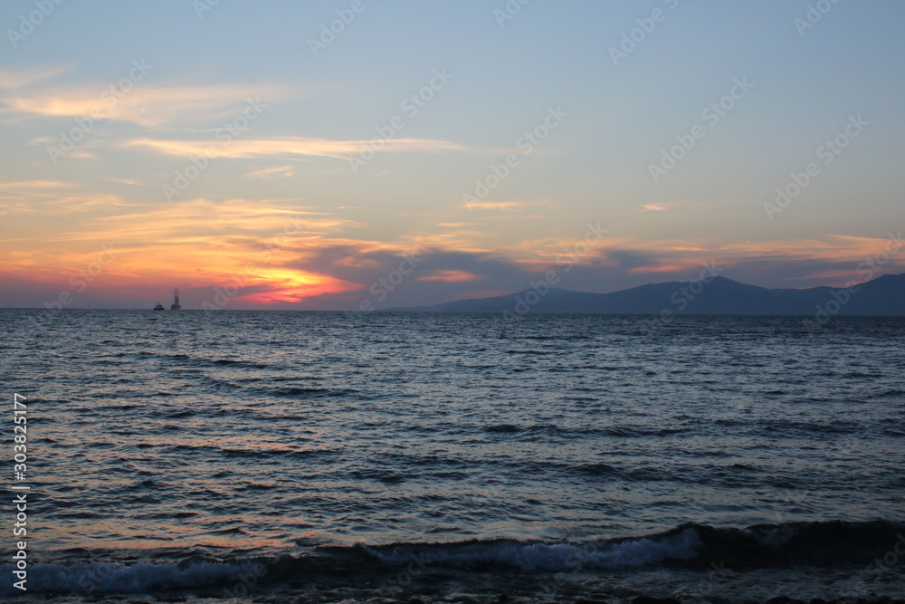 Spectacular sunset, Mykonos island in the Aegean sea, Greece
