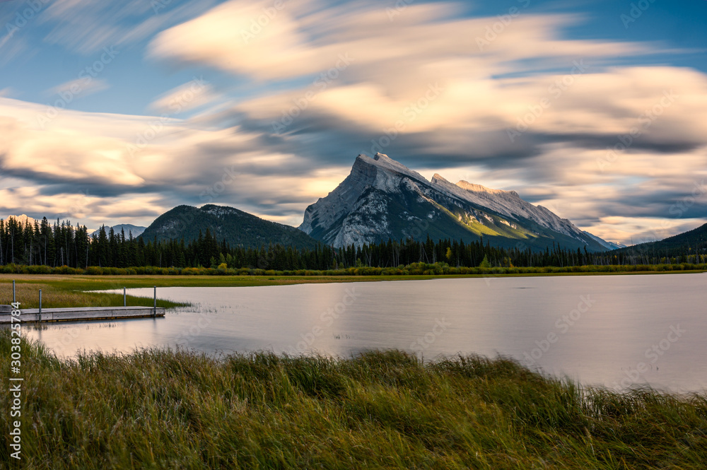 Mount Rundle in Vermillion lake with wooden pier on sunset at Banff national park