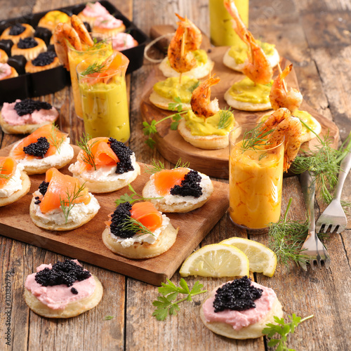 Fotografia assorted of finger food, buffet food with verrine and canape- festive table