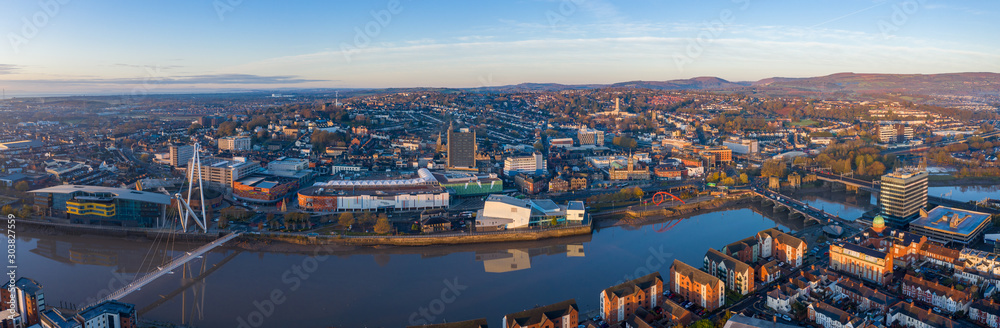 An aerial view at sunrise of Newport city centre, south wales United Kingdom, taken from the River Usk