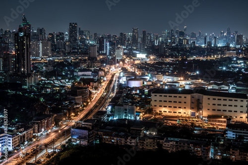 Beautiful view of Bangkok city, Beauty skyscrapers along Chaopraya river in the night, making the city modern style.